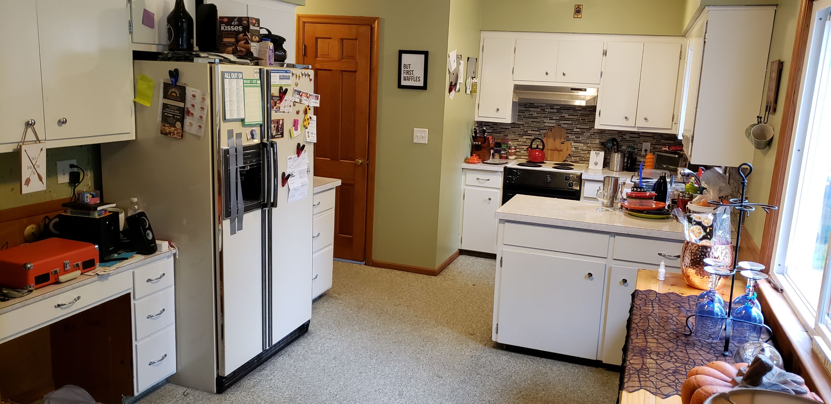 older white kitchen that needs remodeled