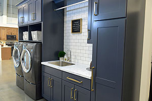 Blue cabinetry shown in laundry room setting