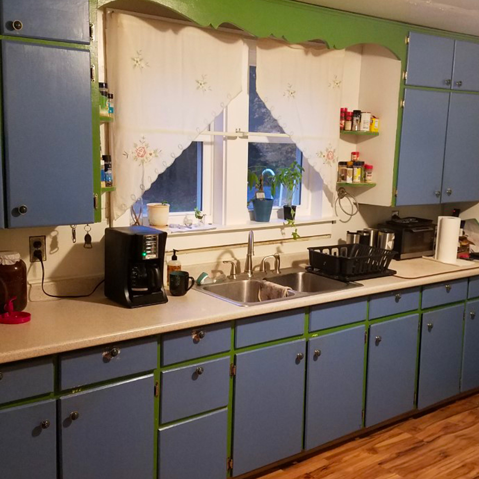Entry 105 - These old, painted cabinets are in desperate need of a renovation