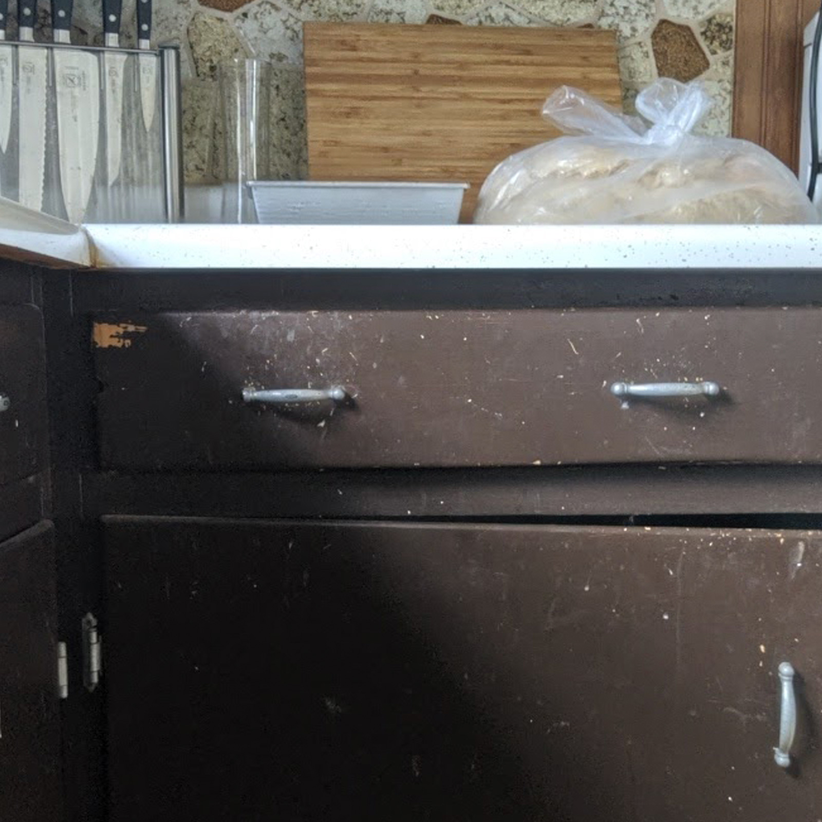 Entry 141 - Over used cabinets have made this kitchen unsightly
