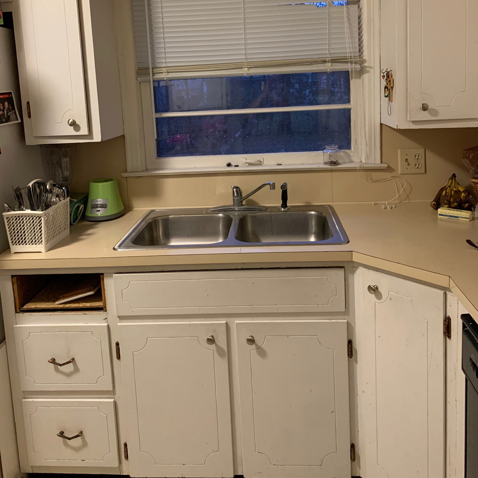 Entry 164 - Boring color scheme and outdated cabinets make for a tired kitchen