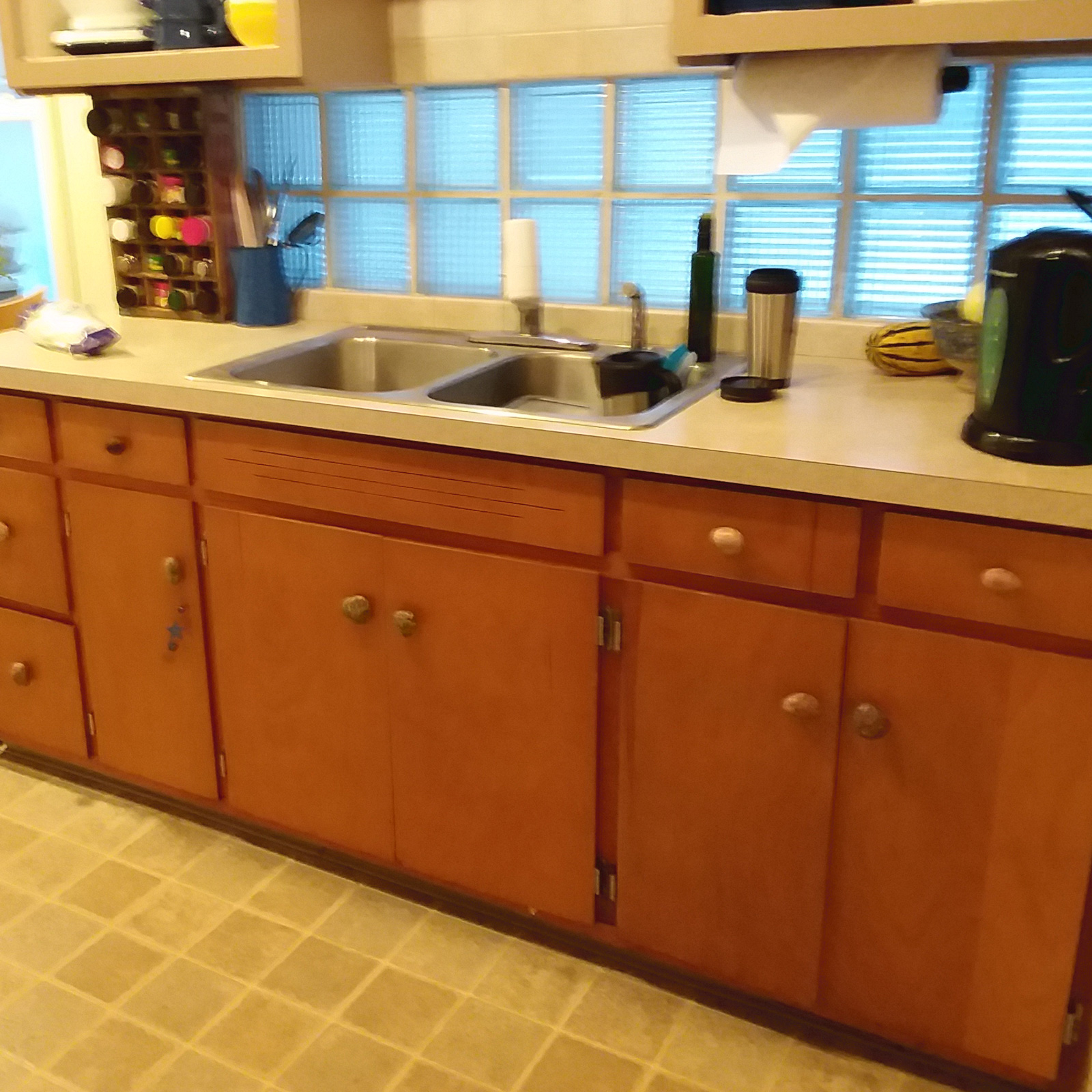 Entry 67 - These outdated cabinets are in poor shape and the kitchen needs an updated look