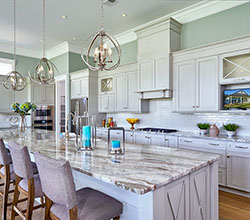 UltraCraft Cabinetry Style: Crystal Lake  Material: Maple  Finish: Melted Brie